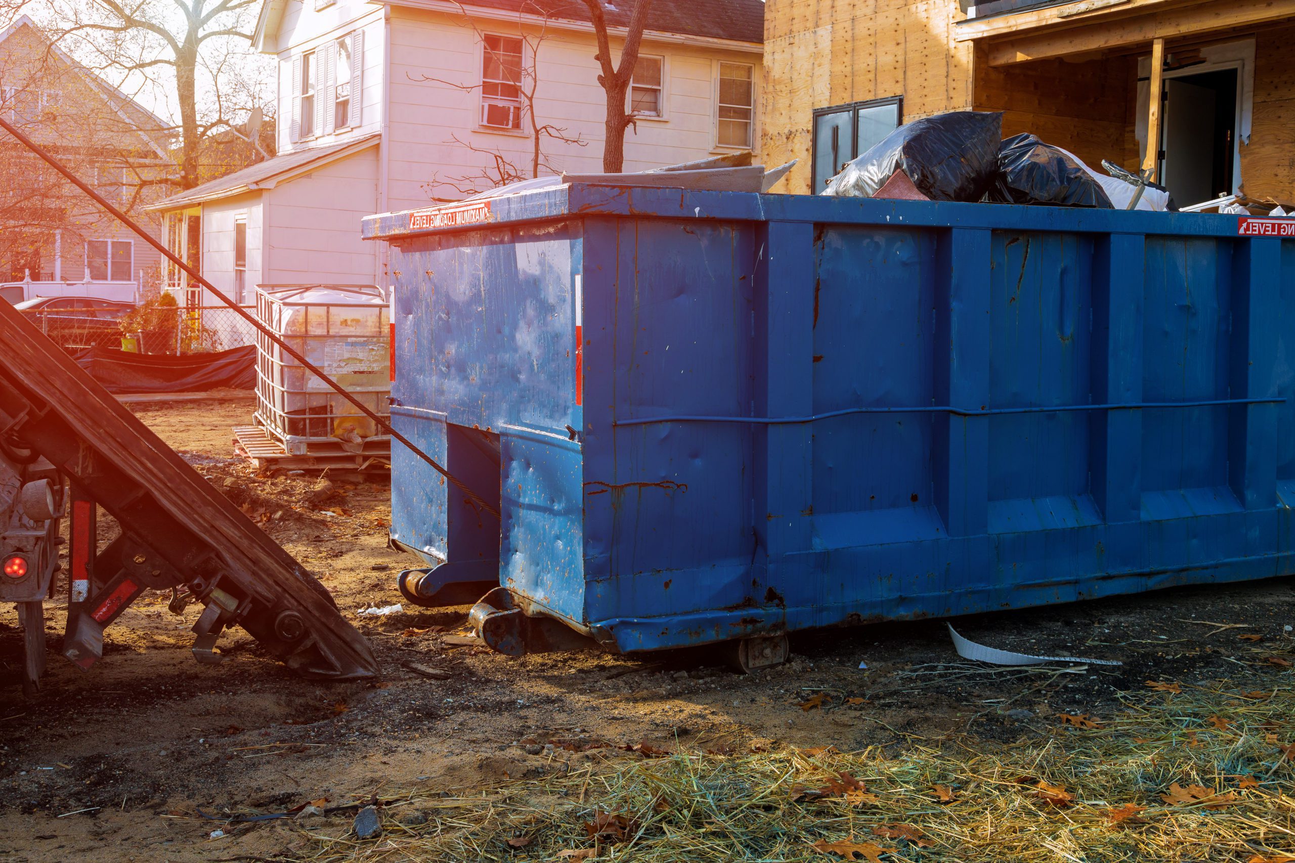 blue dumpster collecting waste, cleaniowallc waste pickup services